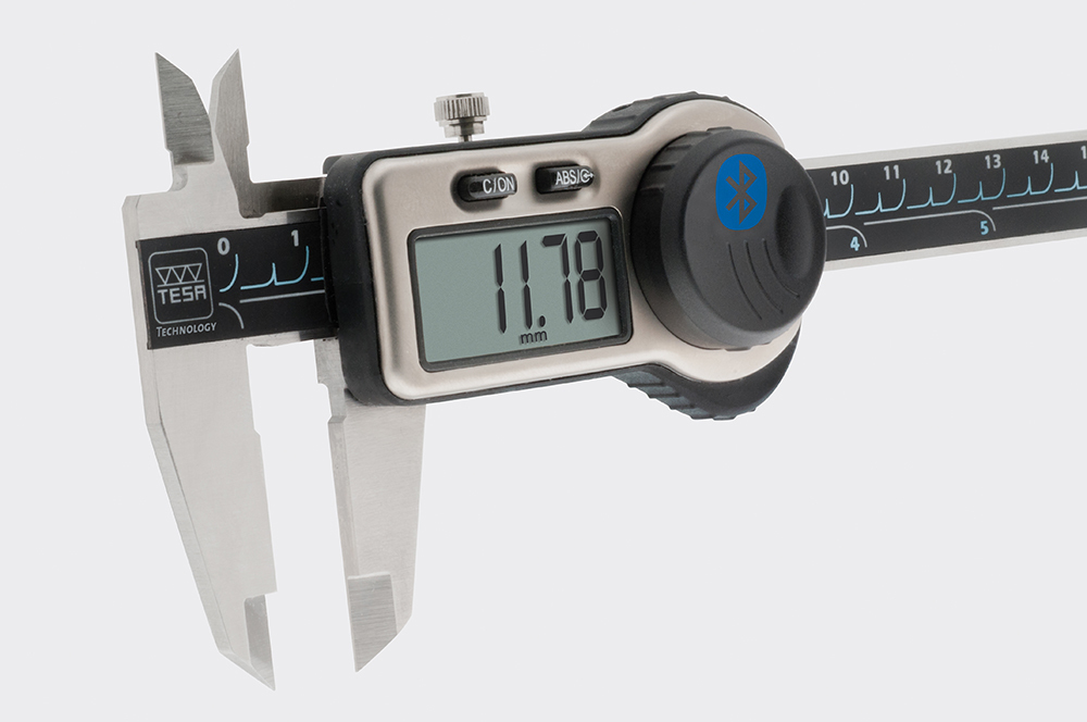 Hexagon devices sold without Bluetooth capability can often be upgraded with bottle cap-shaped transmitters, above. | Photo courtesy of Hexagon-TESA Technology.
